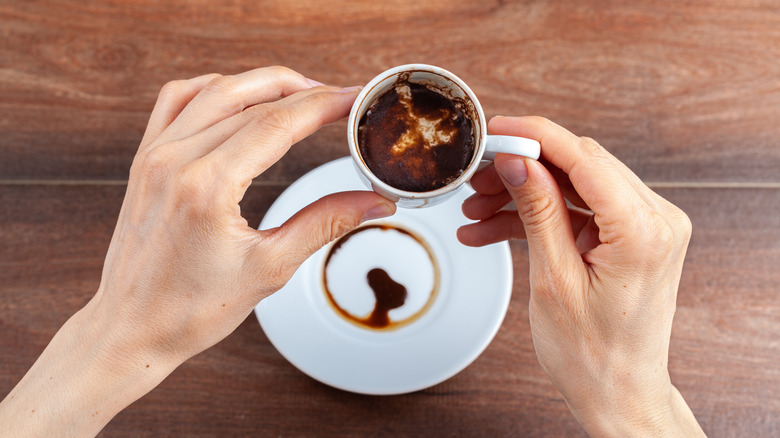 Leftover Turkish coffee grounds in cup