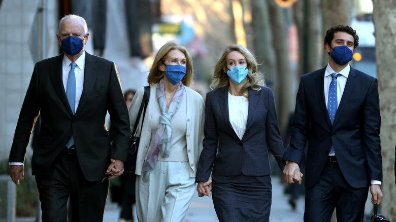 Elizabeth Holmes and family arrive for trial