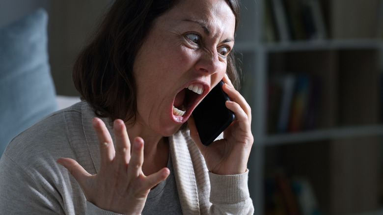 Woman yelling on phone