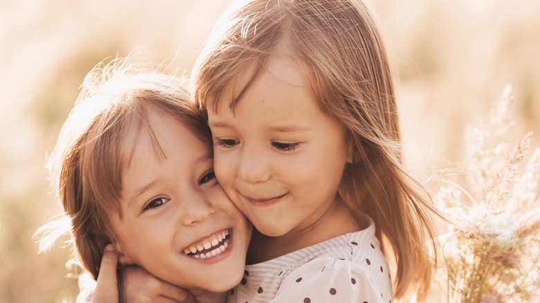 siblings hugging