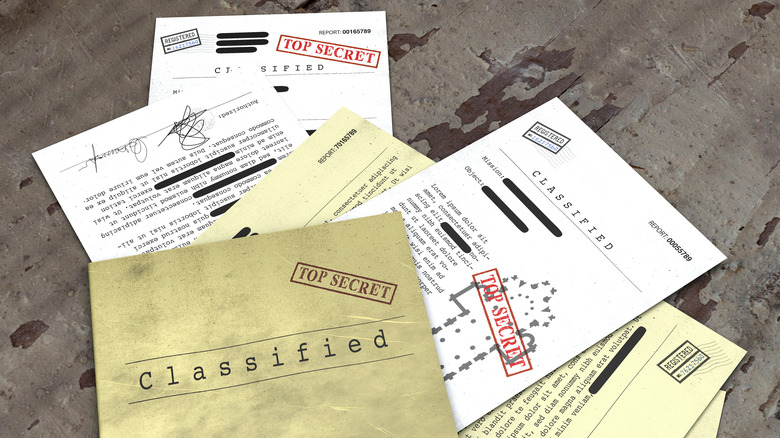 Redacted classified document pile 