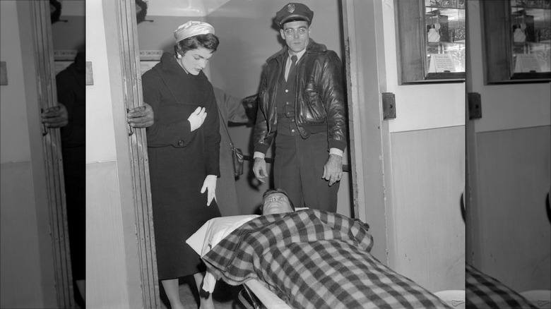 JFK on stretcher after surgery