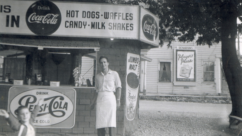 A 1956 drive-in with worker outside