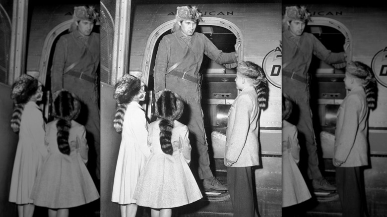 Fess Parker greets young fans in costume as Davy Crockett