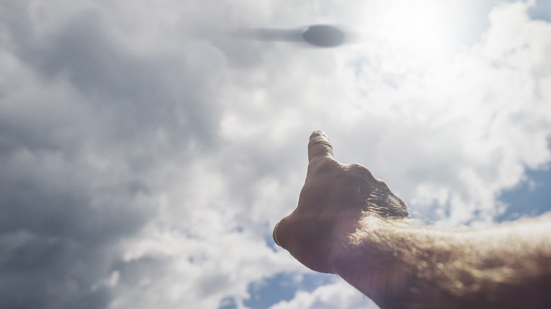 Guy pointing at UFO in sky