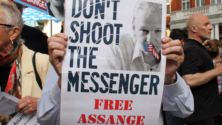 placard supporting Julian Assange