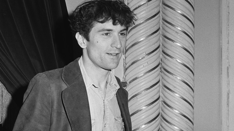 Robert De Niro '70s messy hair casual suit smiling