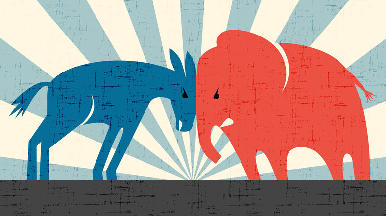 Democratic donkey and Republican elephant butt heads