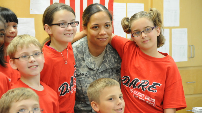 DARE program instructor with graduates at Fort Rucker