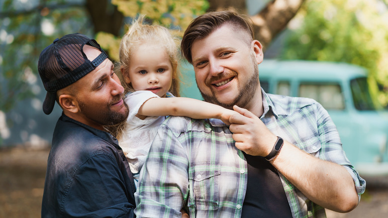 A gay couple with their daughter