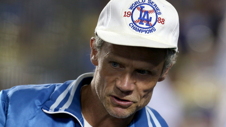 Flea in baseball cap and blue jacket