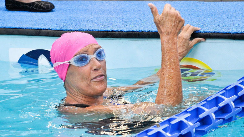 Diana Nyad in pool in cap and goggles