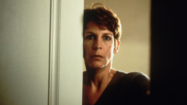 Jamie Lee Curtis looking through door