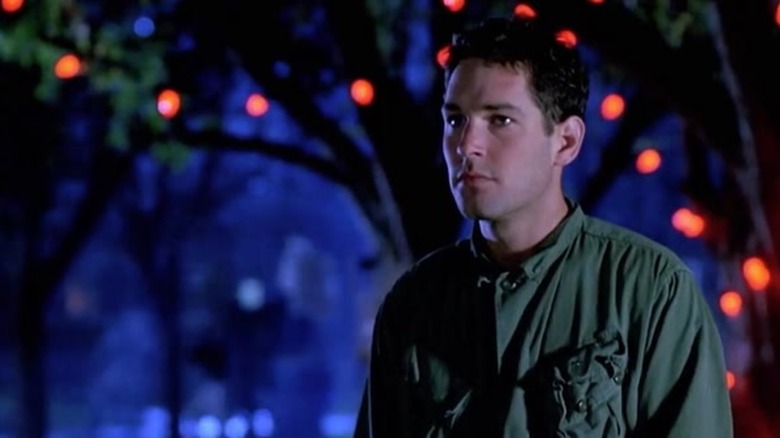 A young Paul Rudd underneath lit tree