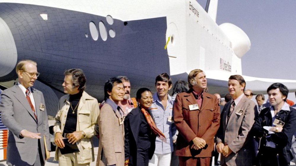 The cast of Star Trek with the prototype space shuttle