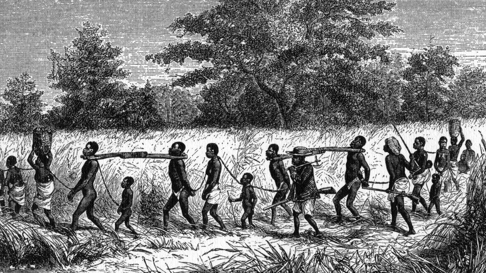 A print showing chained enslaved people being marched to a trading station, 1965