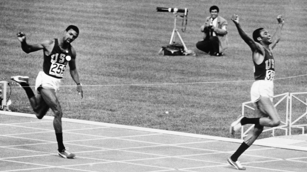 Tommie Smith (right) wins the men's 200 metres at the Olympic Games in Mexico City, 16th October 1968. John Carlos takes bronze