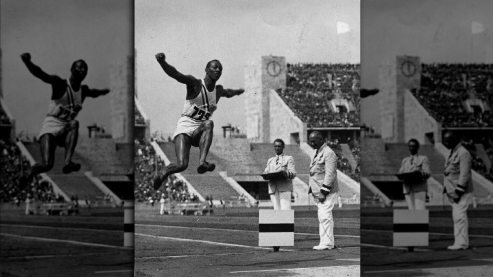 Jesse Owens air during the long jump at the Olympic Games in Berlin