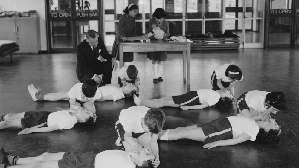 Pupils at the Mount Stewart Junior School in Kenton, Harrow, Middlesex, use a dummy to practise Cardiopulmonary Resuscitation or CPR, 9th May 1963.