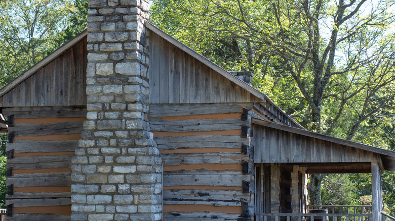 Side view of the Bell Witch cabin, with large stone chimney