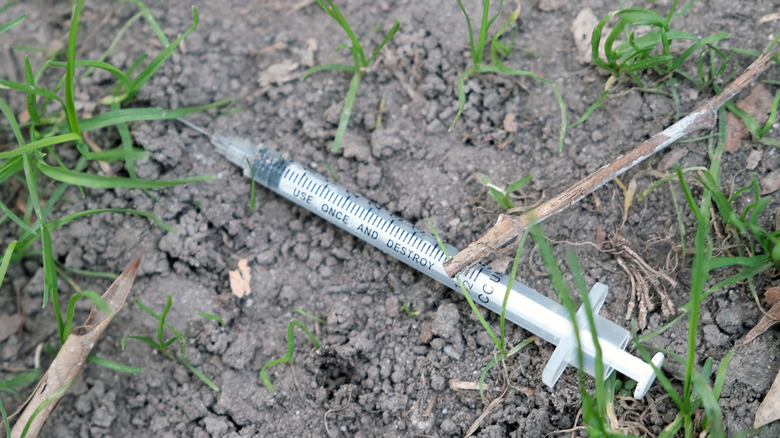 syringe ground grass