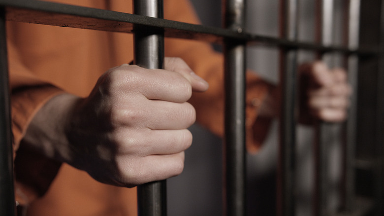 prisoner behind bars