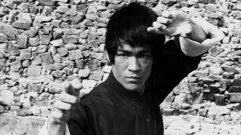 Bruce Lee posing on film set