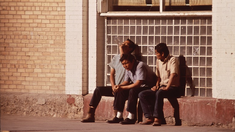 Navajo men sitting and drinking in gallup, new mexico