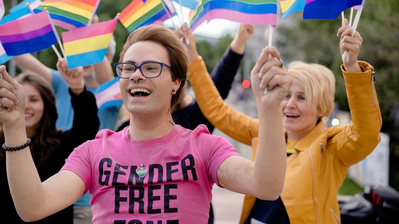 Person wearing gender free shirt marching