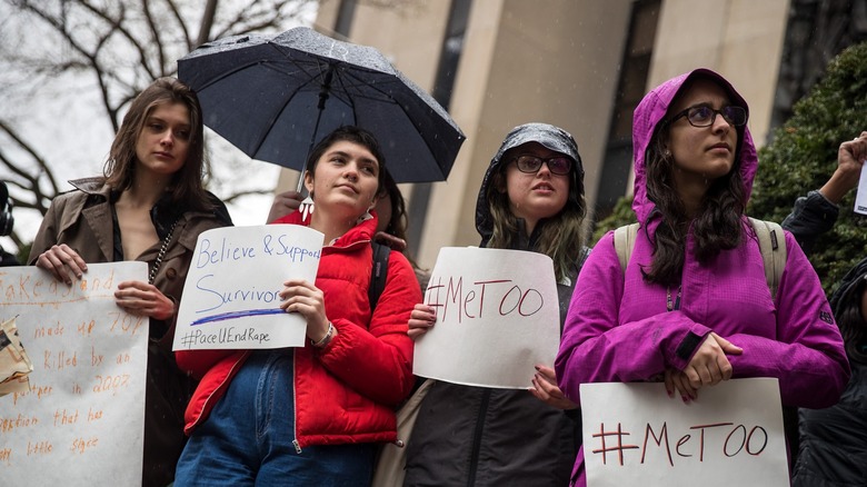 Female protestors holding #MeToo signs