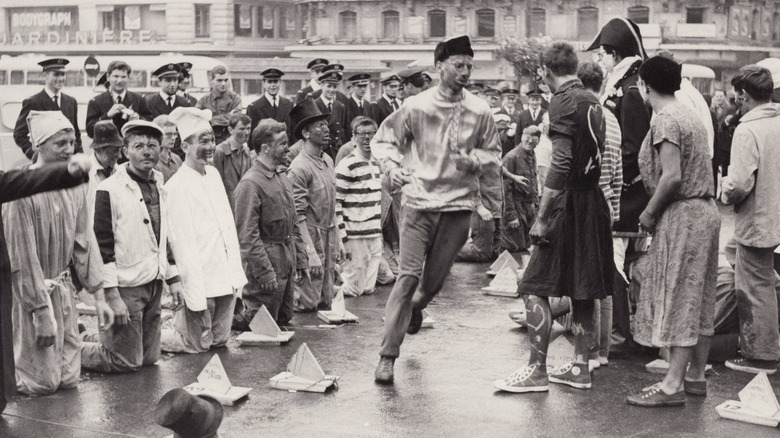 Students wearing costumes running around