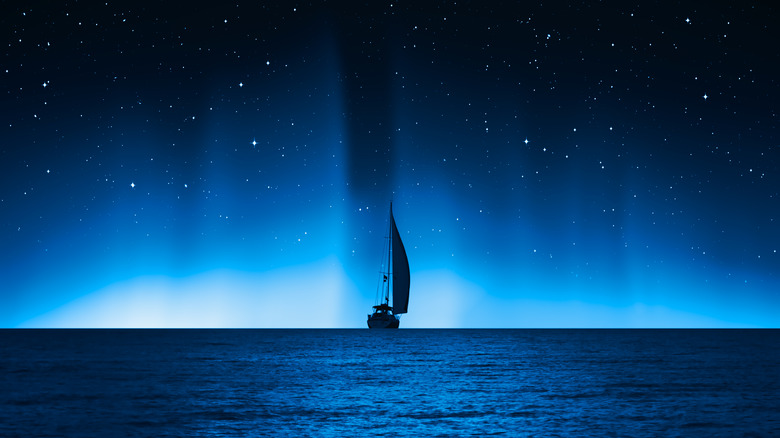 a boat on the ocean at night