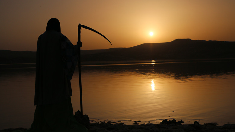 grim reaper watching the sun set