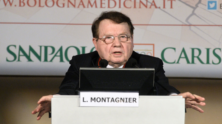 Luc Montagnier speaking at podium