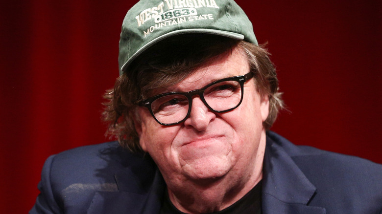 michael moore smirking in hat