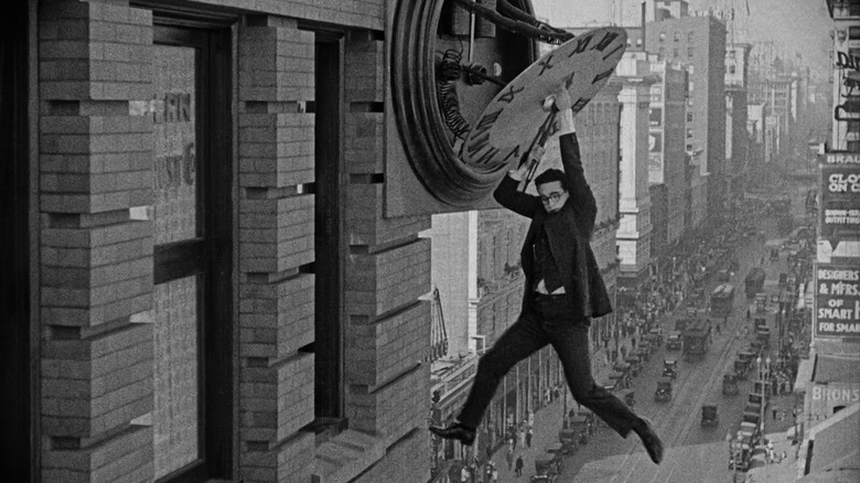 Harold Lloyd dangling above traffic