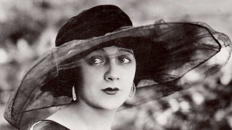 Barbara La Marr wears a hat