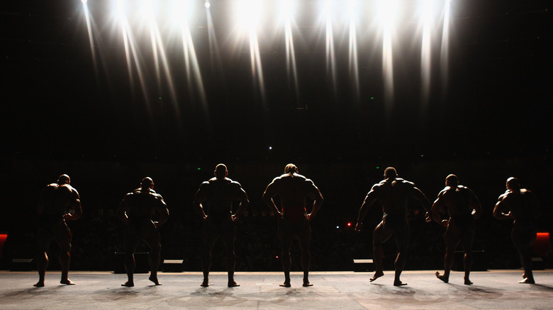 Bodybuilders facing judges