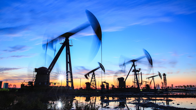 oil pumps silhouetted against sunset