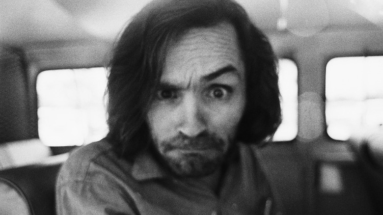 Charles Manson raising his eyebrow