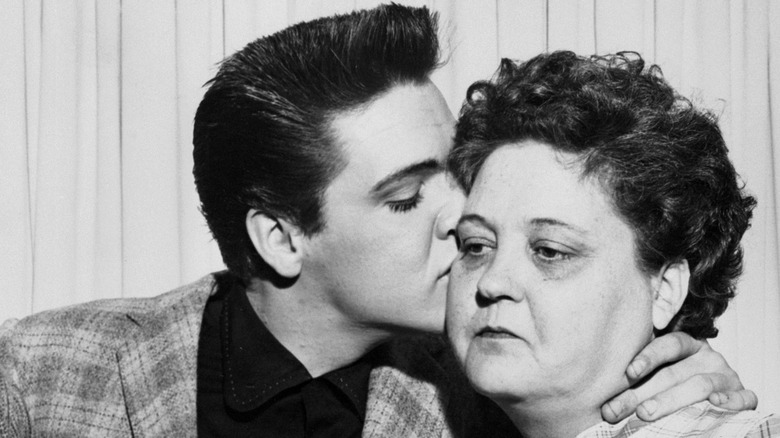 Elvis Presley kisses his mother