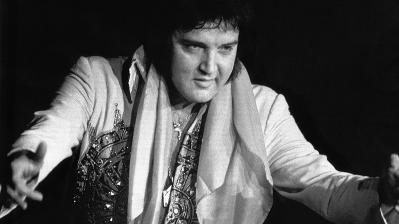 Elvis Presley spreads his arms