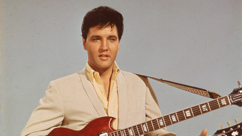 Elvis playing double-necked guitar