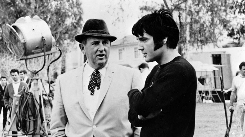 Elvis and Tom Parker talking