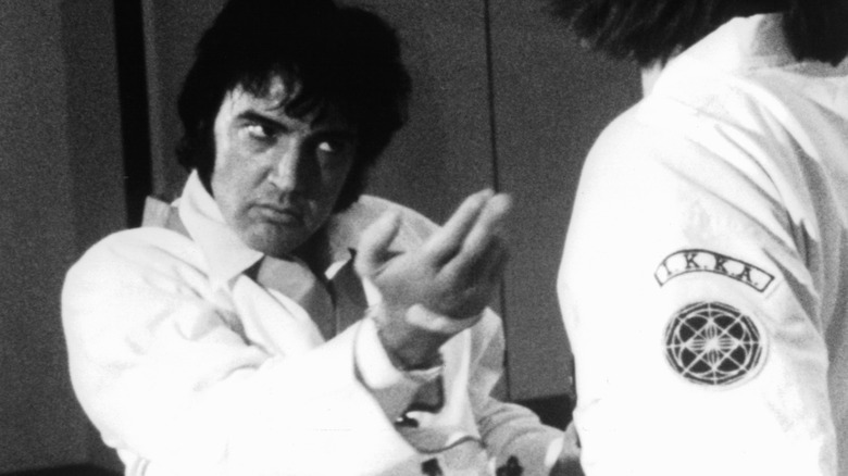 Elvis Presley practices karate