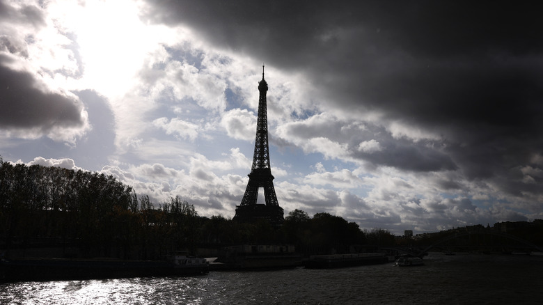 eiffel tower silhouette clouds background