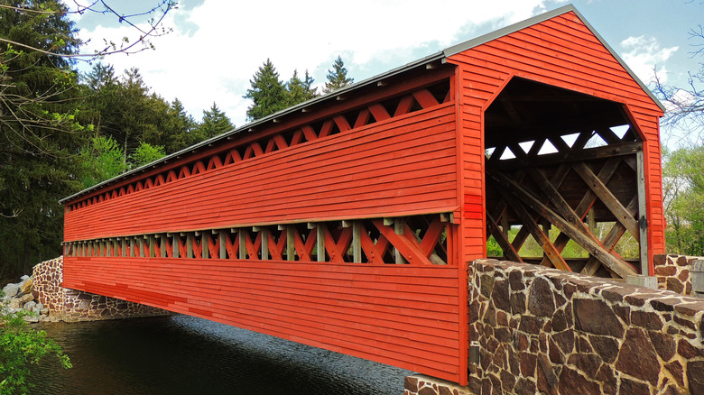 orange sachs covered bridge river