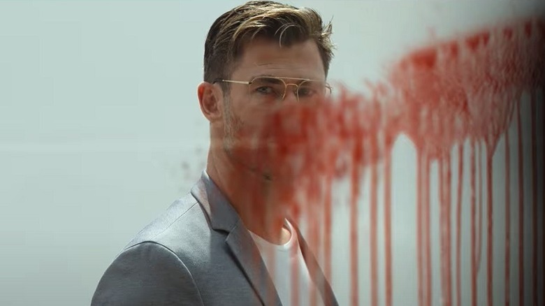 Steve's face is obscured by a blood splatter on glass