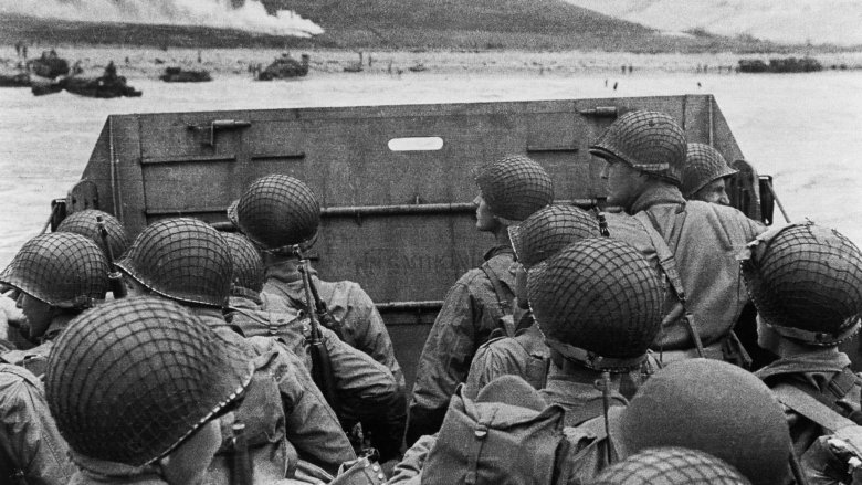 wwii soldiers landing on dday wearing helmets