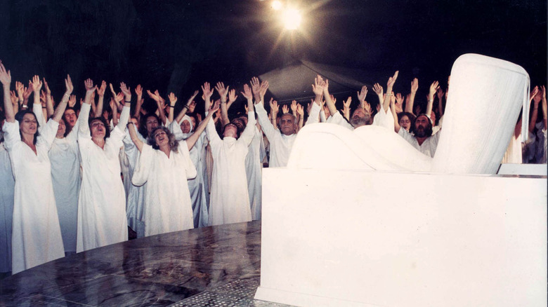 Osho cultists worshipping Osho's chair